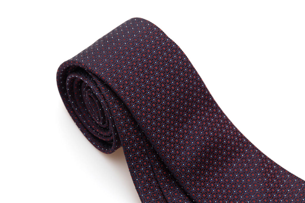 Blue tie with red geometrics in pure silk