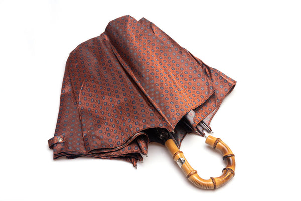 Mario Talarico red folding umbrella with bamboo handle pattern