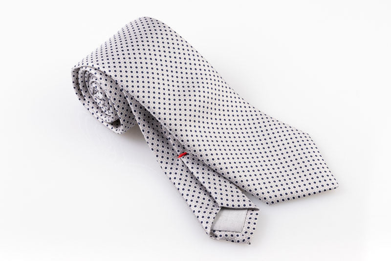 Ice grey tie with blue and white polka dots