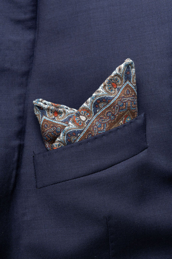 Beige clutch bag with red and blue pattern in pure silk