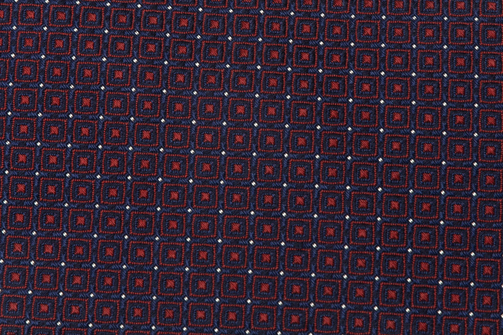 Blue tie with red geometrics in pure silk