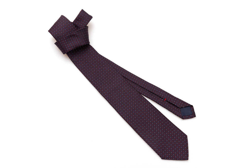 Blue tie with red geometrics in pure silk
