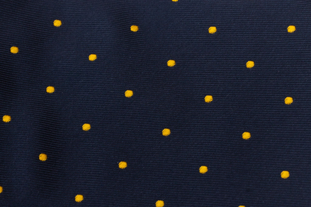 Blue tie with yellow polka dots in pure silk