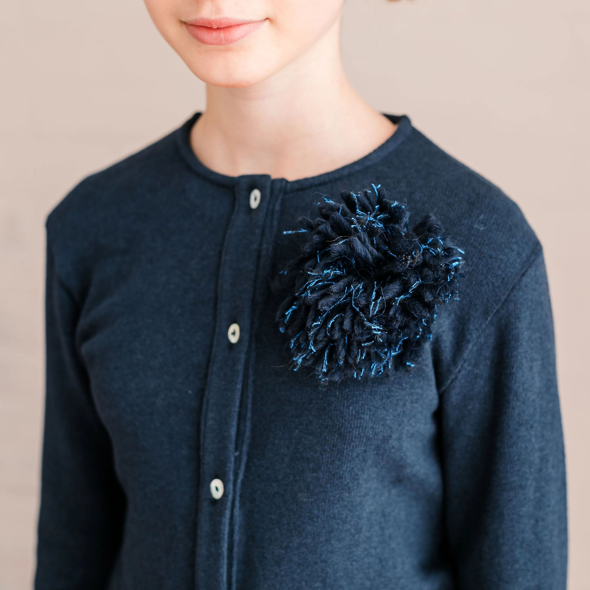 CARDIGAN CON SPILLA POMPON