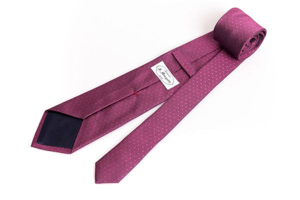 Dark pink tie with micro polka dots in pure silk