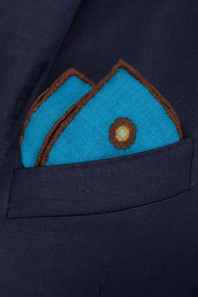 Turquoise clutch bag in pure wool