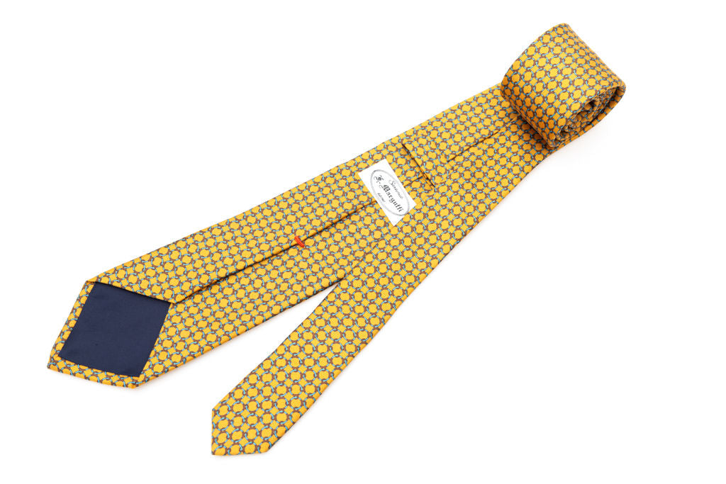 Cravatta giallo ocra con fantasia geometrica 100% seta