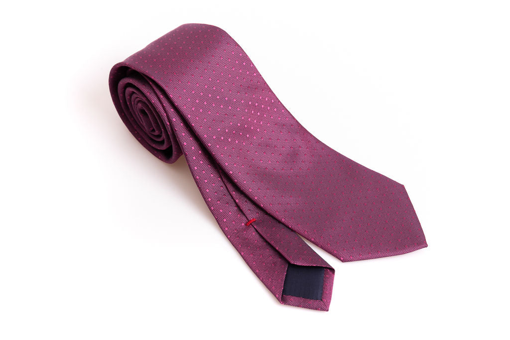 Dark pink tie with micro polka dots in pure silk