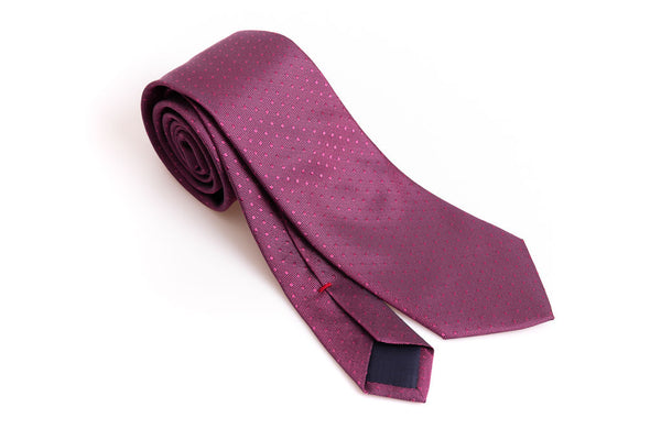 Dark pink tie with micro polka dots in pure silk