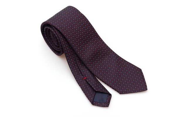 Blue tie with red geometrics in pure silk