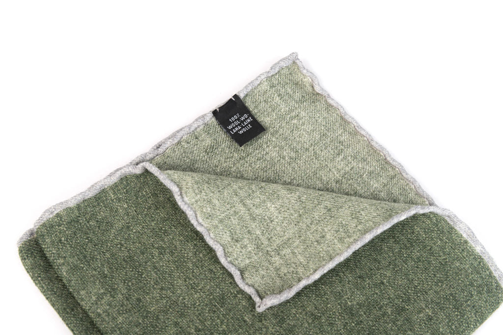 Green clutch bag with pure wool trim