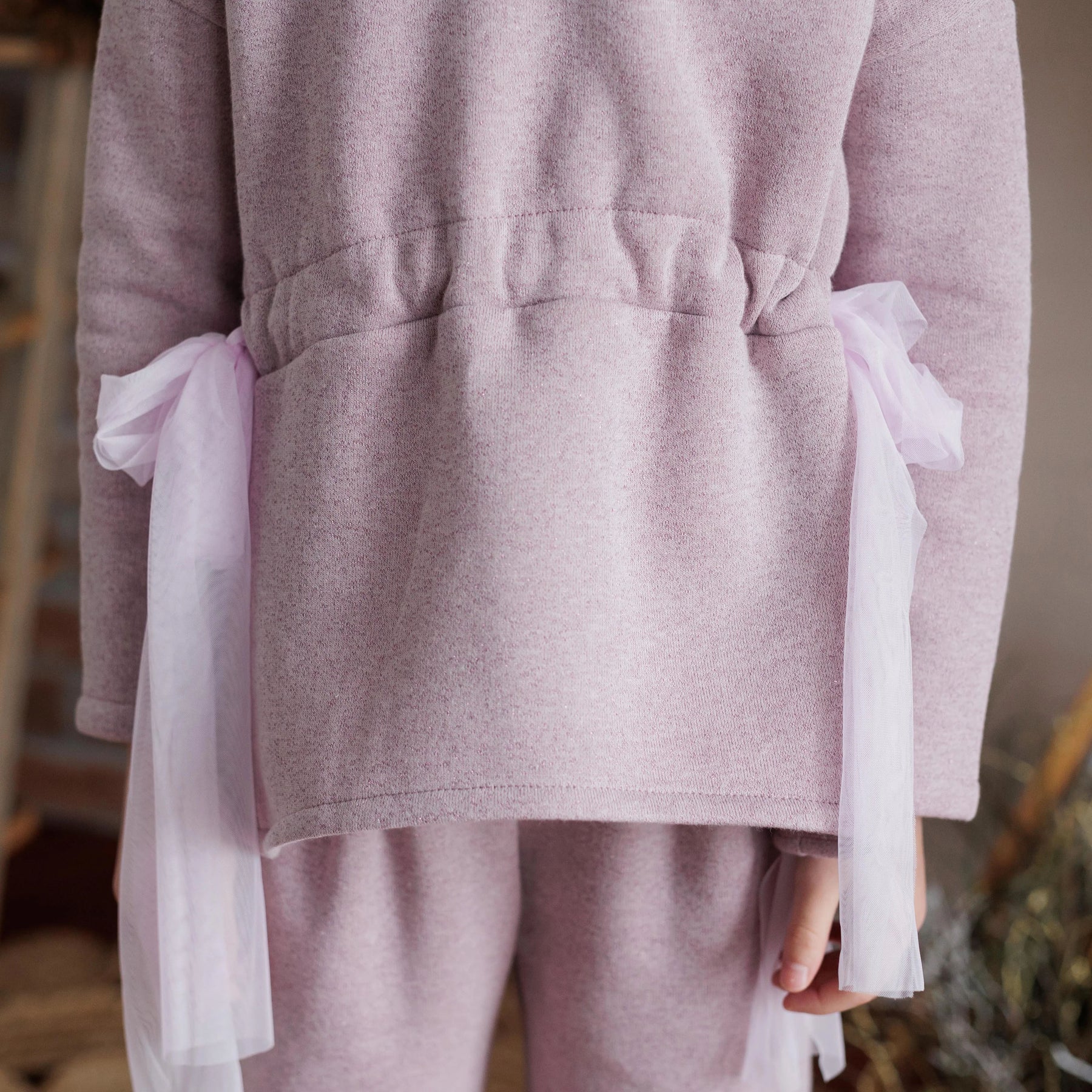 MAGLIA FELPA LUREX CON FIOCCHI IN VITA