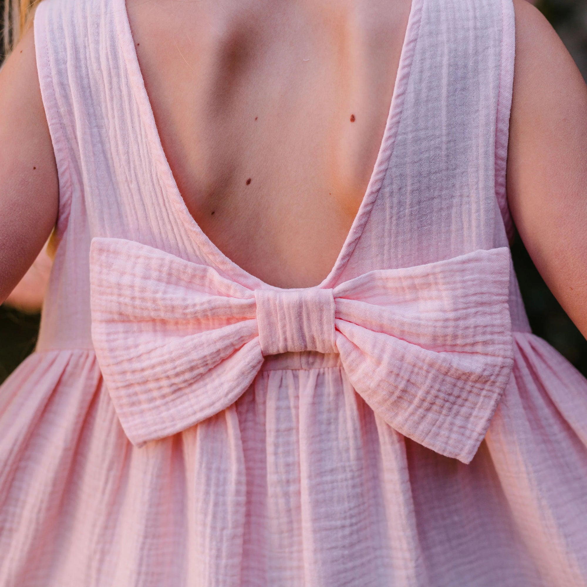 PINK GAUZE DRESS WITH BOW ON THE BACK