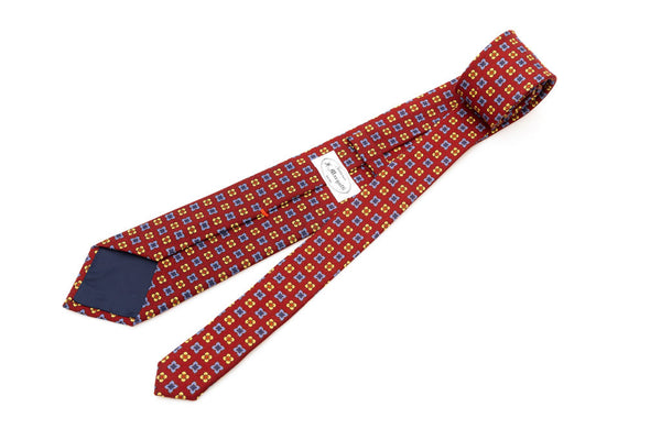 Red base tie with geometric pattern pure wool