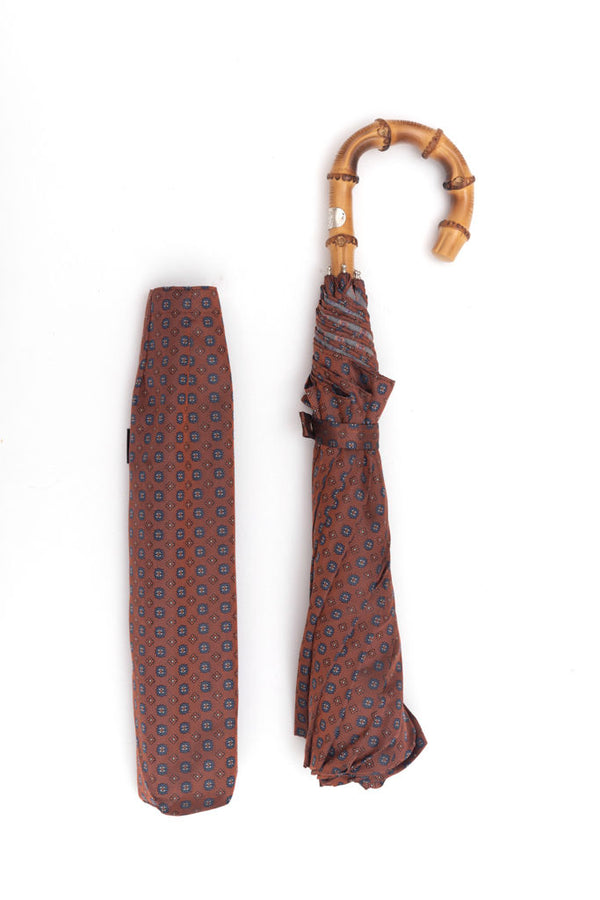 Mario Talarico red folding umbrella with bamboo handle pattern