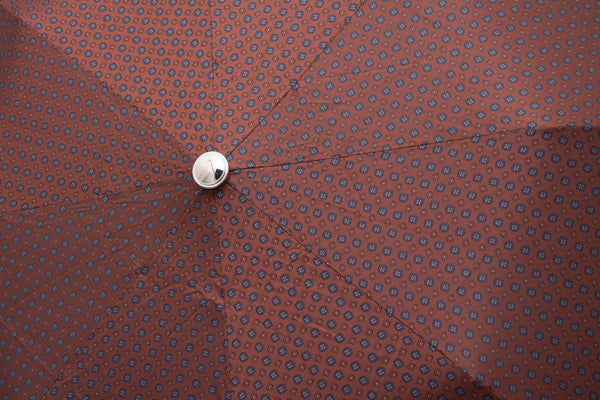 Mario Talarico red folding umbrella with bamboo handle pattern