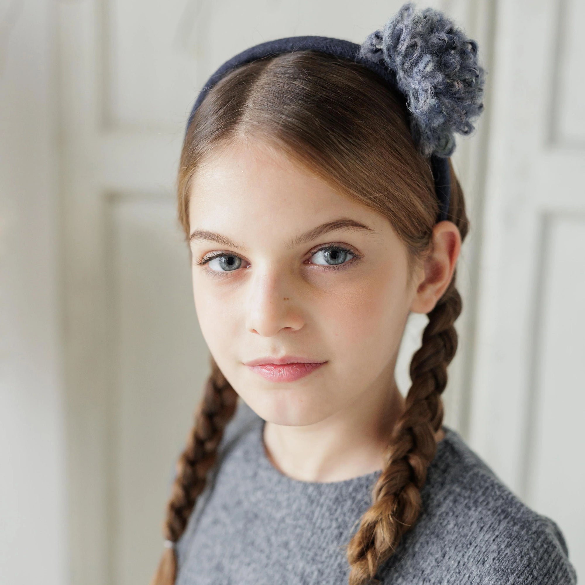 HEADBAND WITH POM PON
