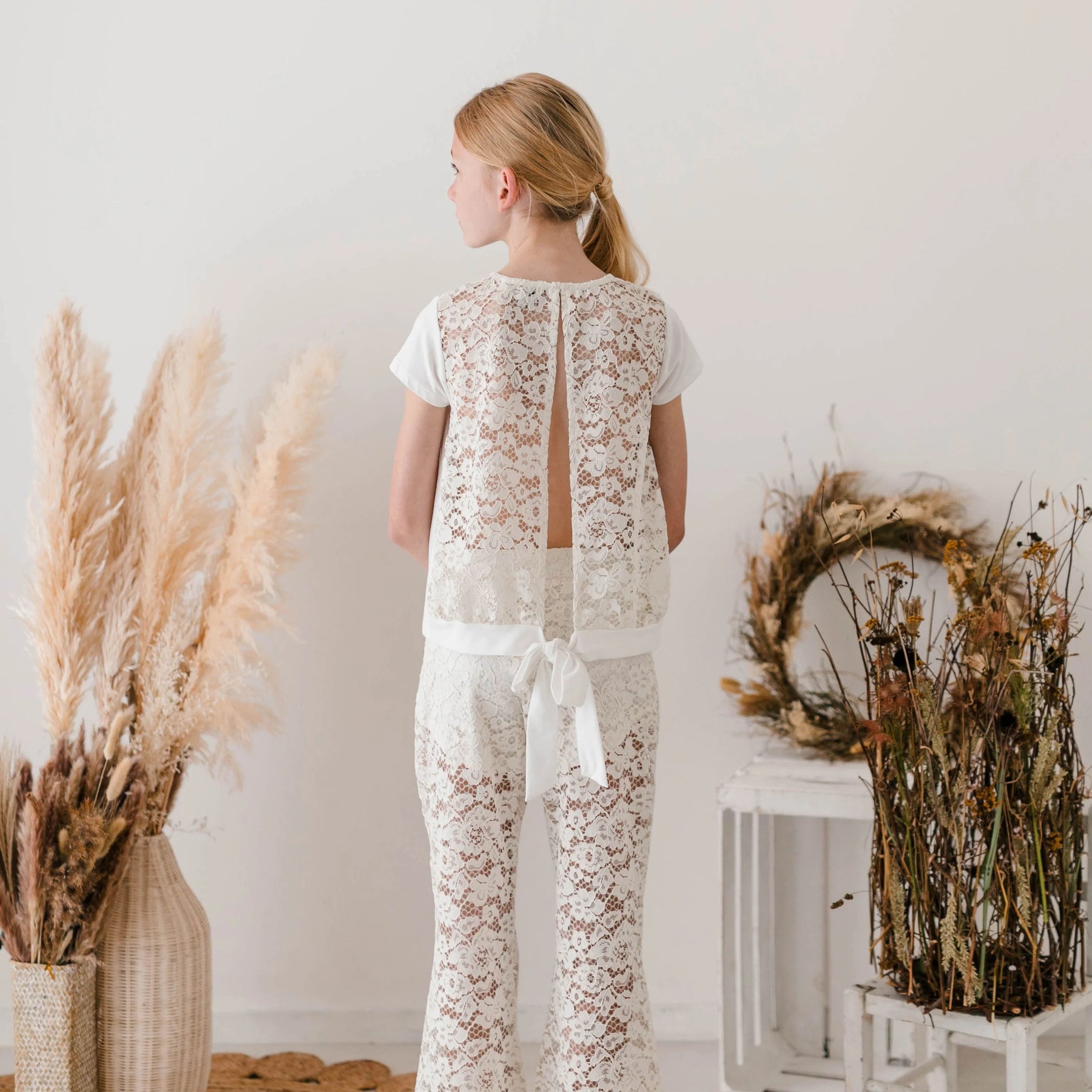 PANTALONI FLARED IN PIZZO