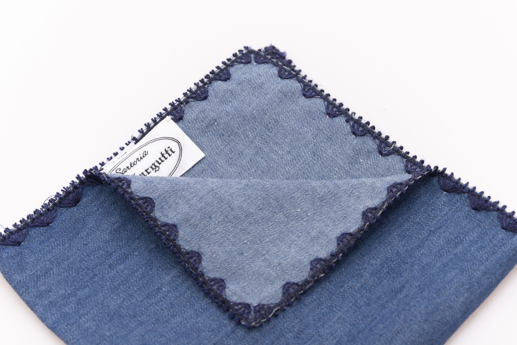 Pochette blu denim in cotone con bordo