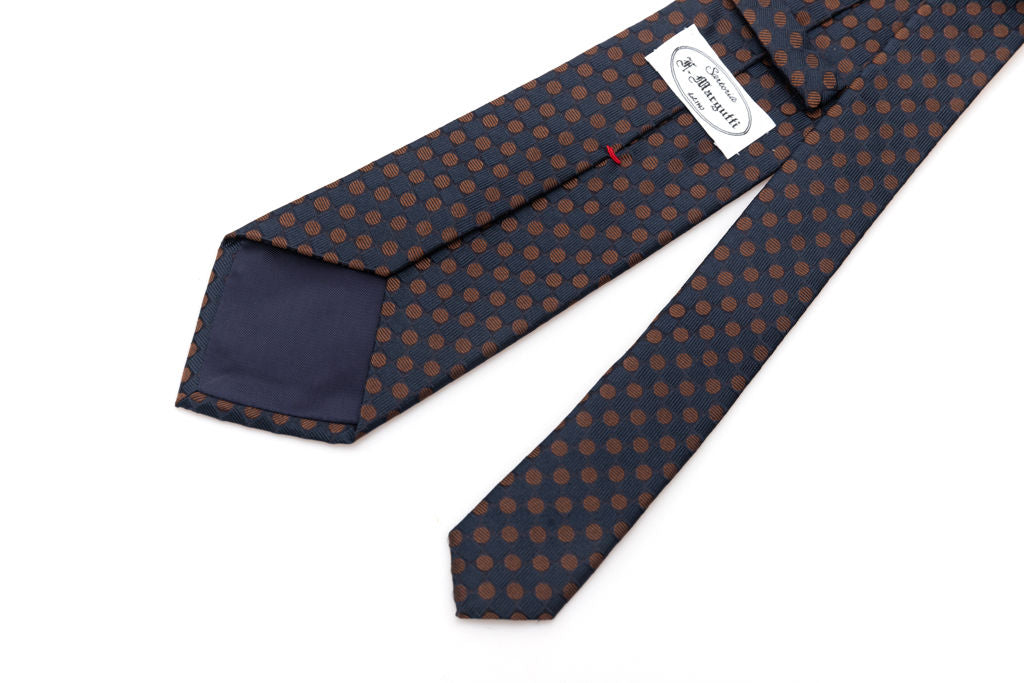 Cravatta blu con pois marrone in pura seta