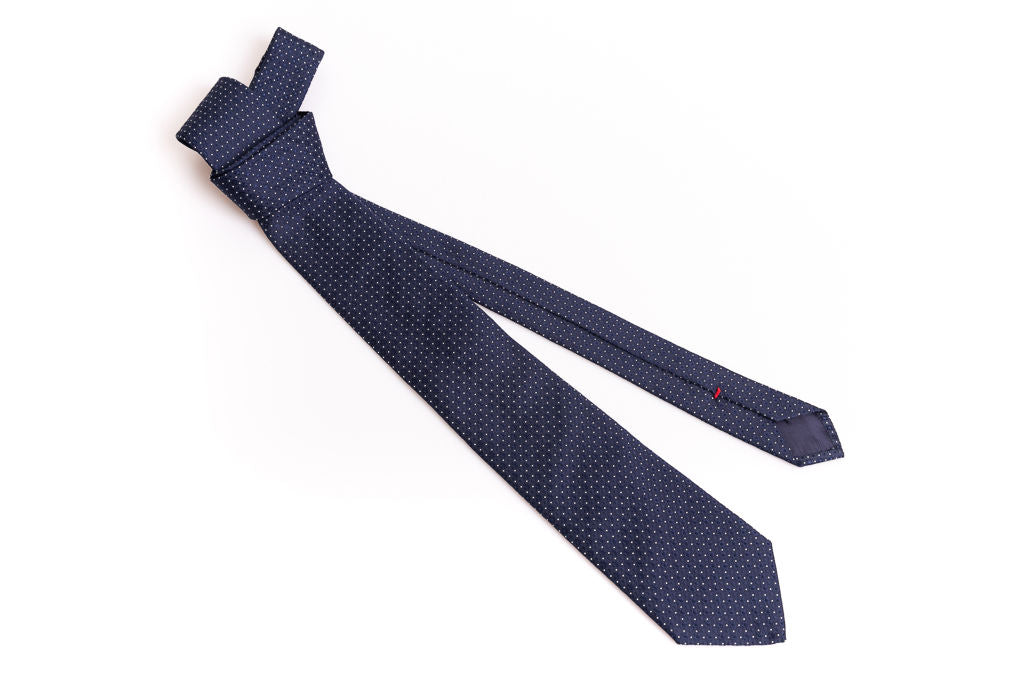 Navy blue tie with micro polka dots in pure silk