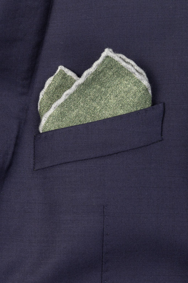 Green clutch bag with pure wool trim