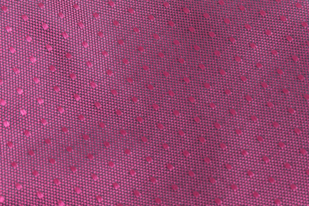 Dark pink tie with micro polka dots in pure silk