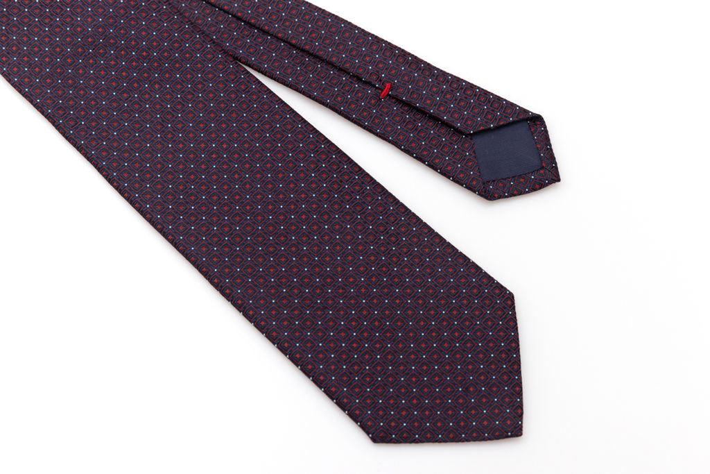 Blue tie with red geometrics in pure silk